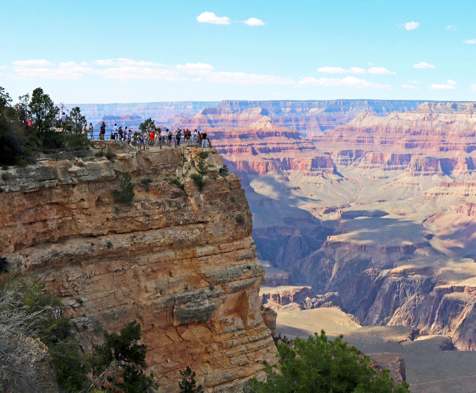 Grand Canyon South Rim overlook with layered canyon walls stretching into the distance