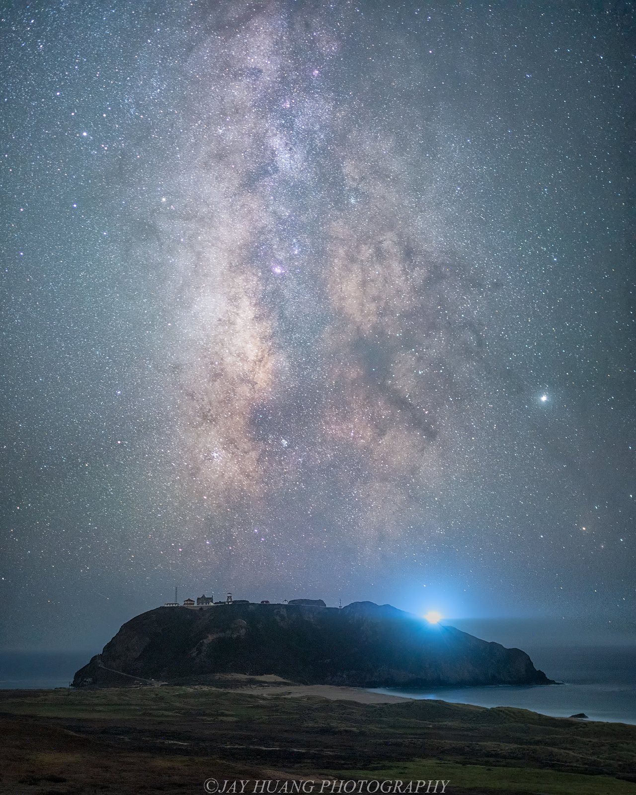 Point Sur Lighthouse and night sky above the Big Sur coast
