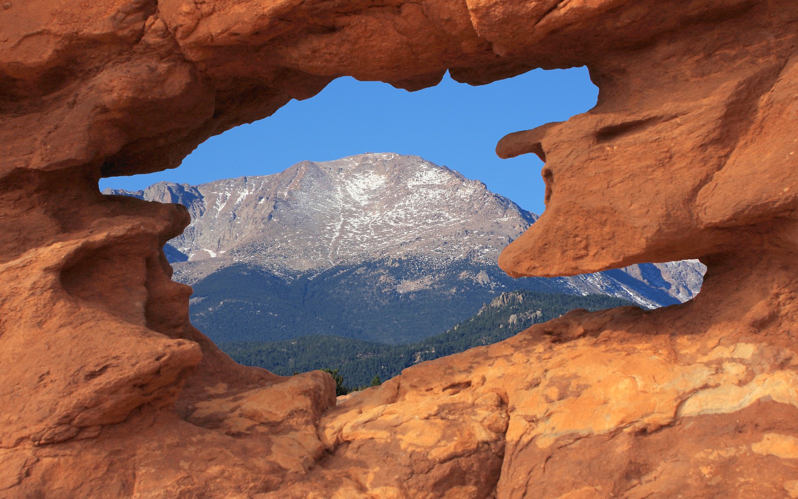 Pikes Peak framed by the Siamese Twins rock formation in Garden of the Gods