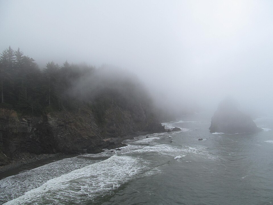 Forested headlands, sea stacks, and Pacific coves along the southern Oregon coast